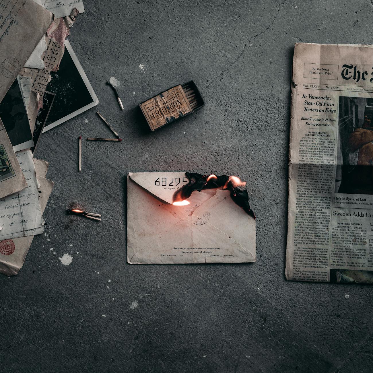 burning envelope on the ground