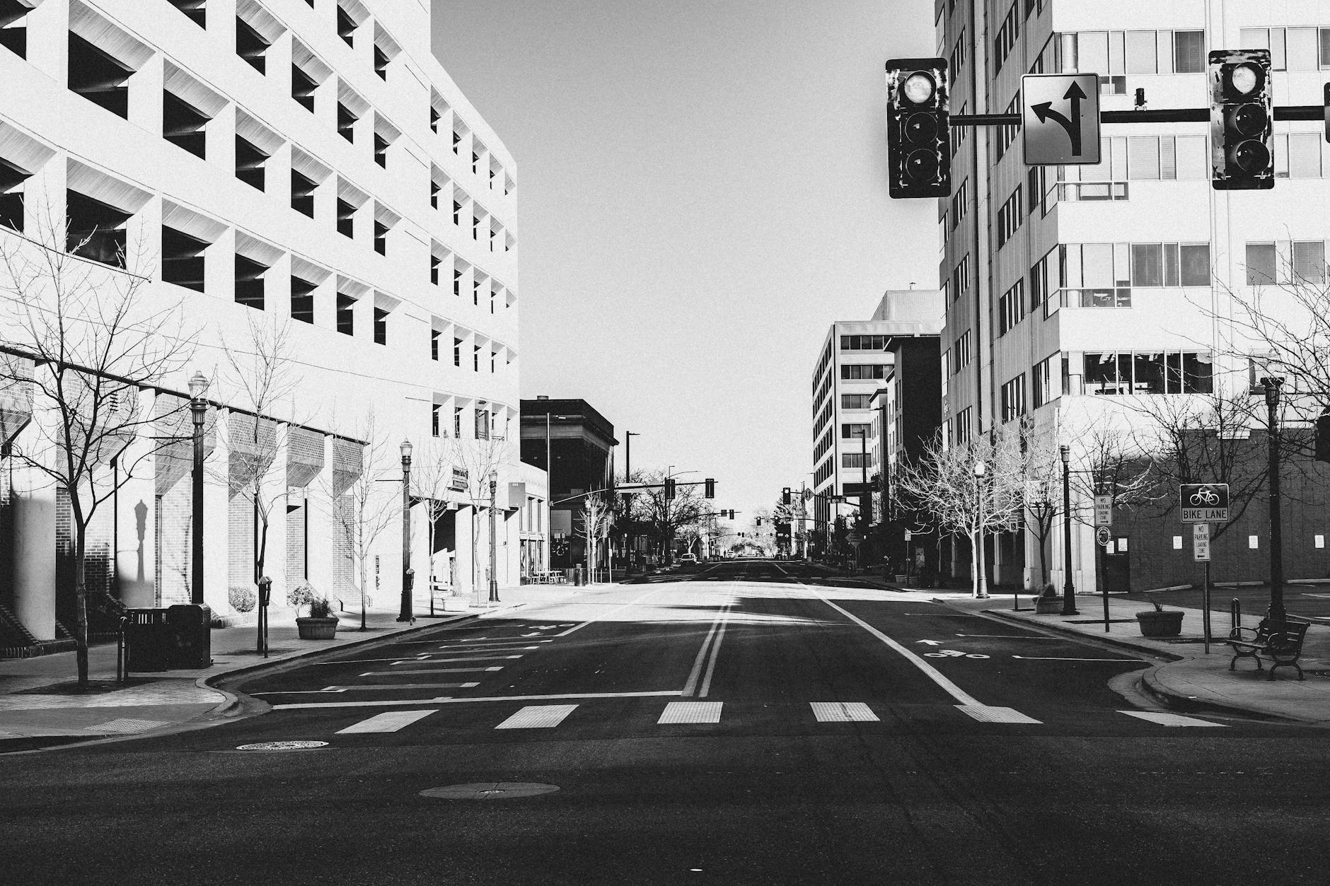 grayscale photo of city buildings